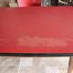 Kitchen table and its 4 chairs in wood and red formica, 1950