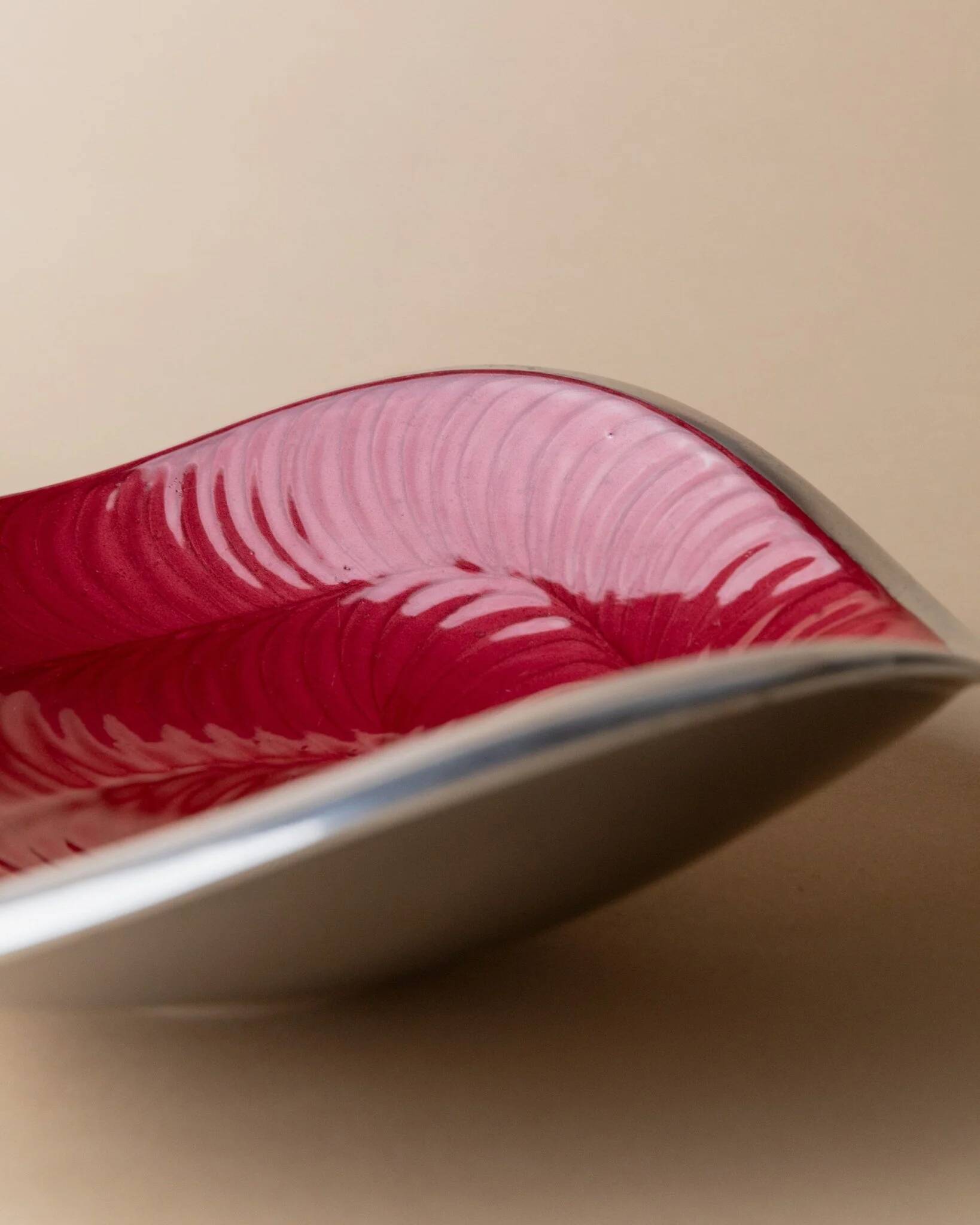 Red enameled steel bowl with textured interior and silver exterior; vintage Italian 1970s design