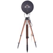 Old industrial spot on wooden tripod