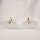 Swan neck sconces in serrated opaline