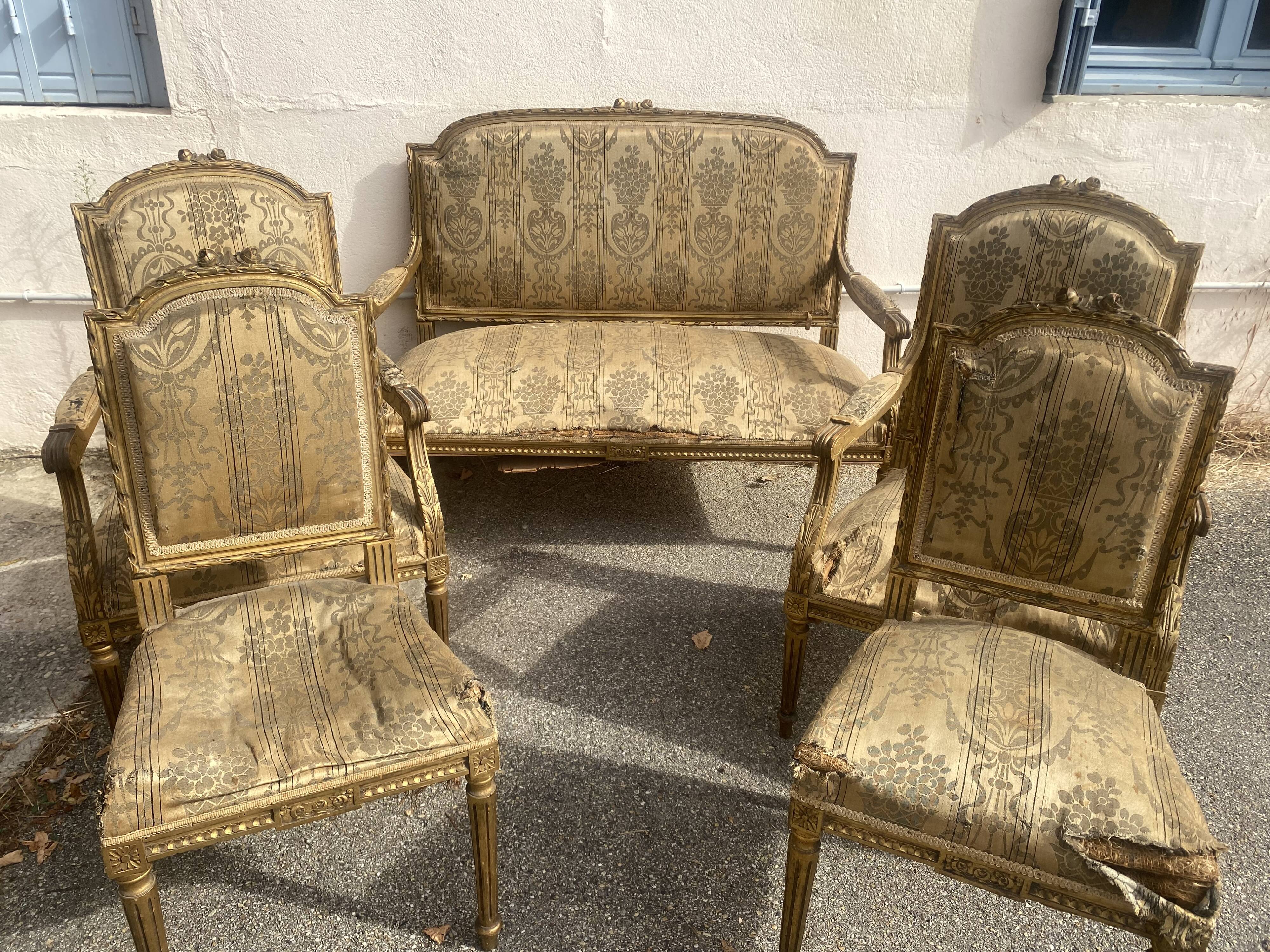 Louis XVI style living room in gilded wood. Napoleon III period