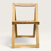 Blonde wooden folding chair in the style of Aldo Jacober.
