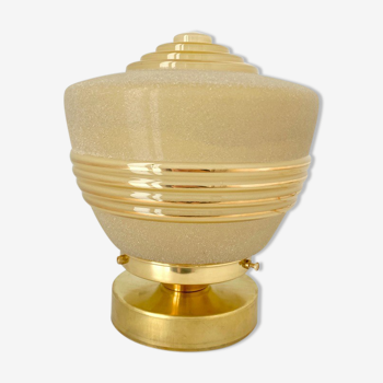 Old globe table lamp in beige and gold glass