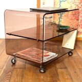 Smoked Plexiglas coffee table on wheels -