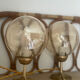 2 bedside lamps with round amber glass globes and gold metal.
