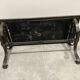 Brutalist-style coffee table made of mixed wrought iron and stone.