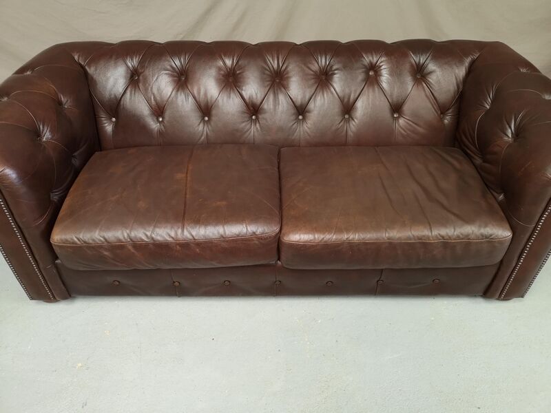 Three seater brown leather chesterfield sofa