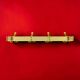 Vintage wall-mounted coat rack in anodised gold aluminium – 4 hooks – 1960s