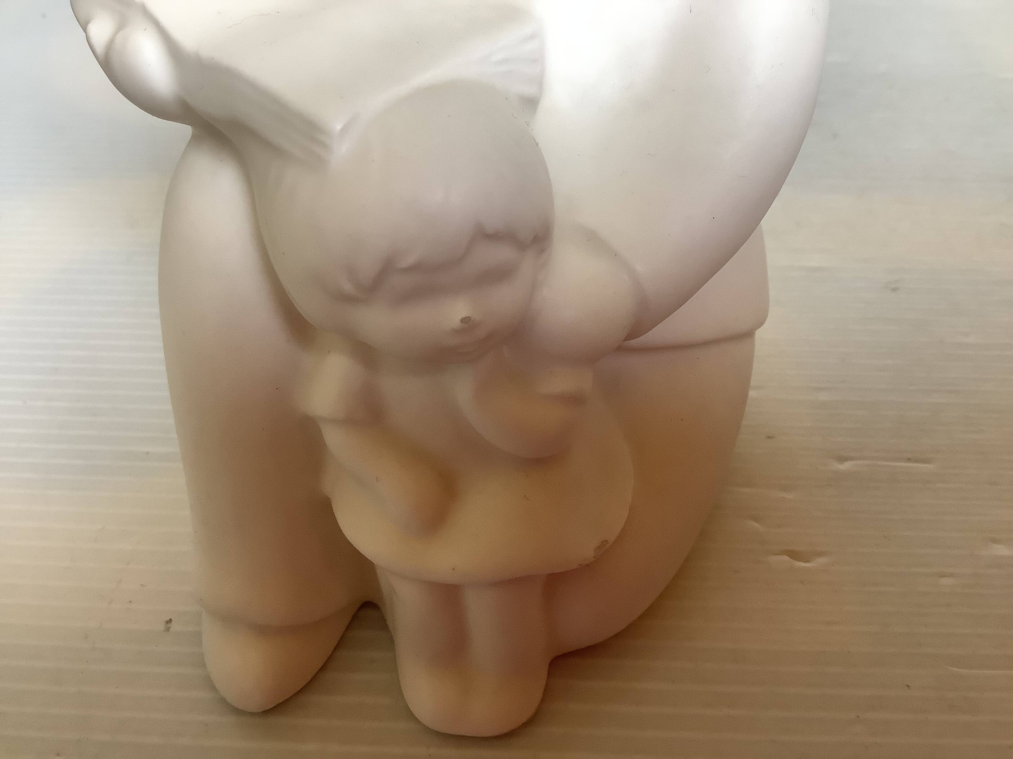 Pair of bookends with a matte white glaze for children.
