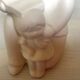 Pair of bookends with a matte white glaze for children.