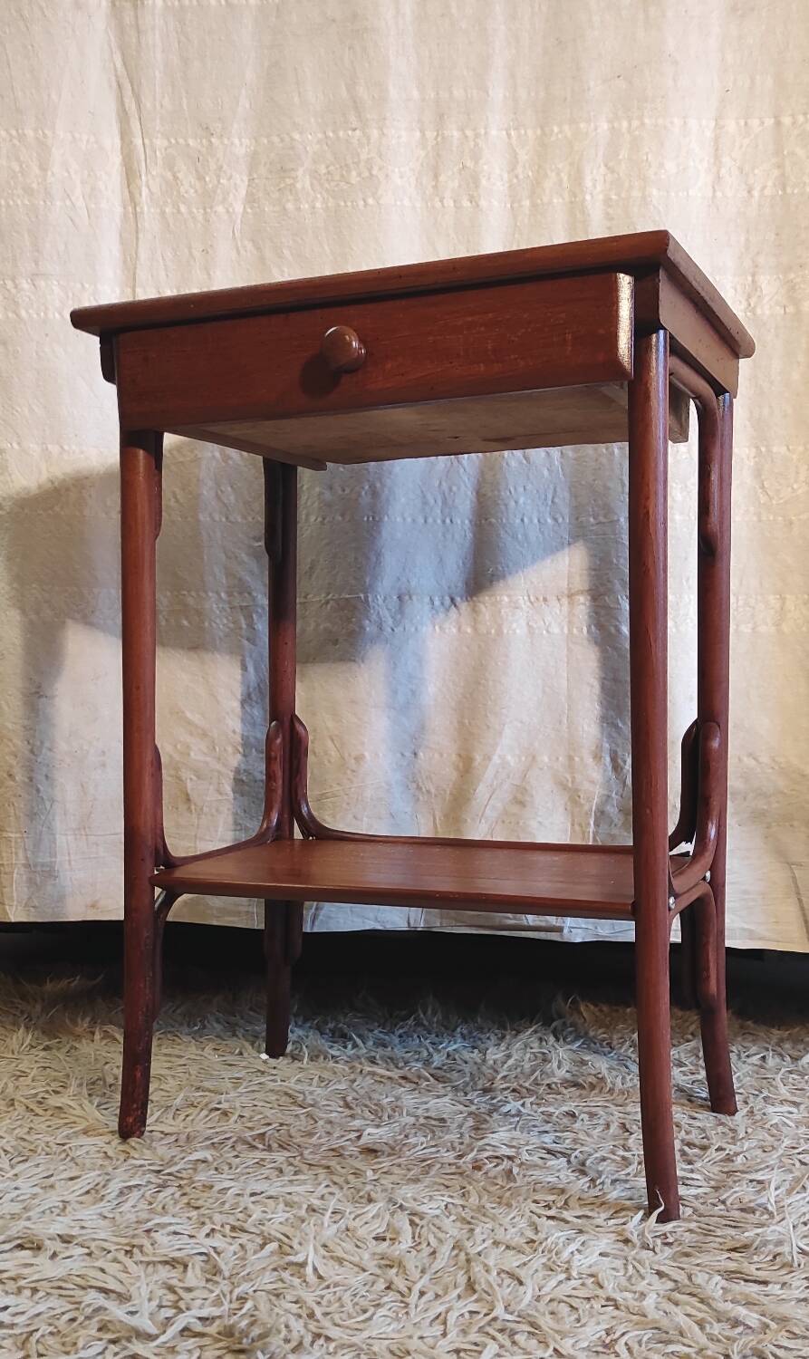 Curved solid wood side table - early 20th century