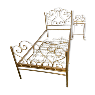 Wrought iron bed and its bedside