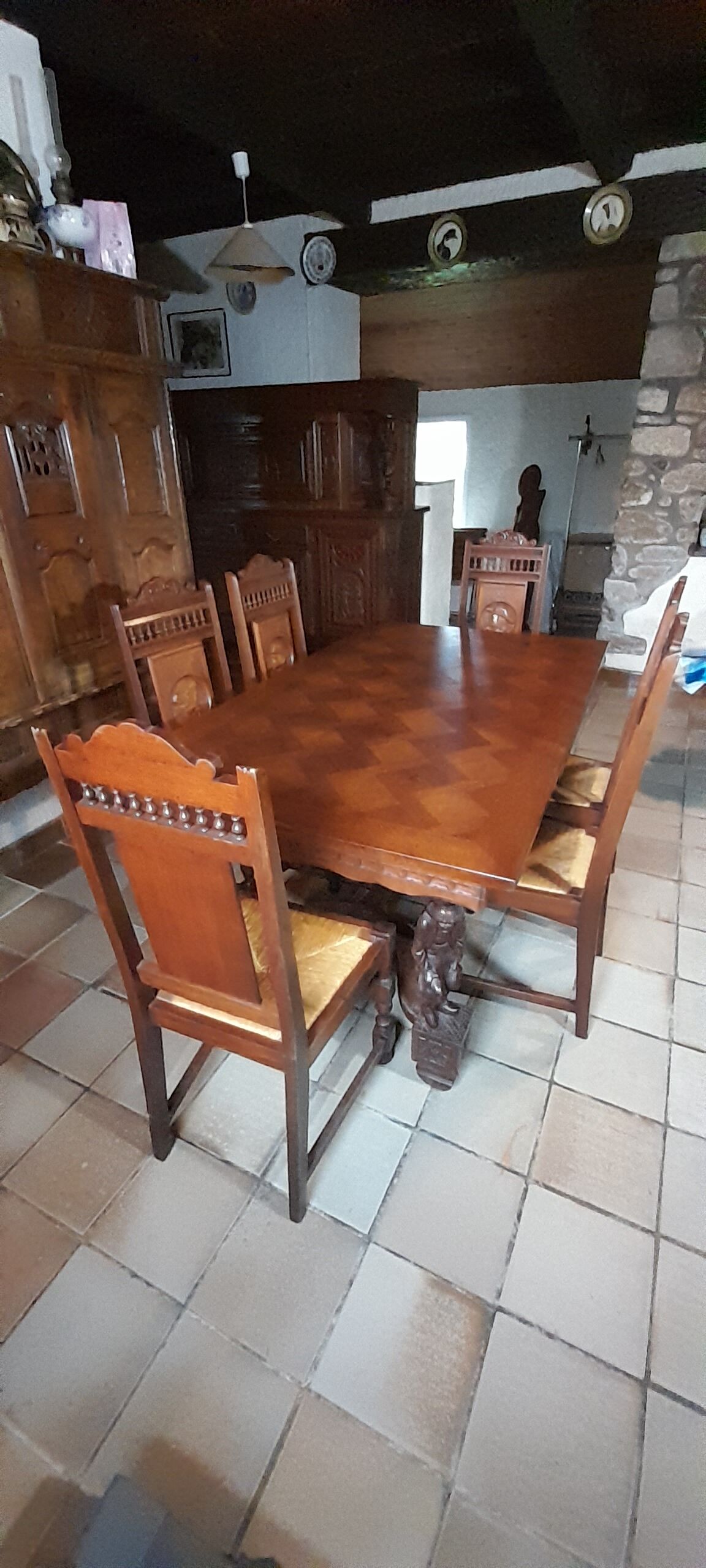 Breton dining room table with 2 extensions and 6 chairs with carved Breton characters