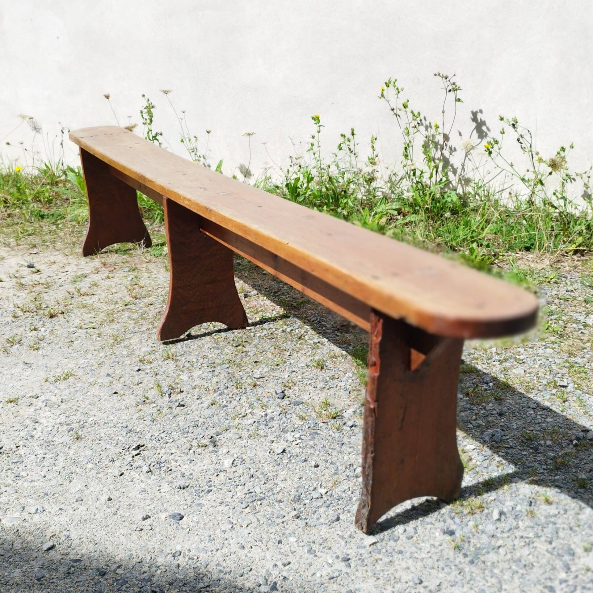 Authentic vintage farmhouse bench in varnished wood