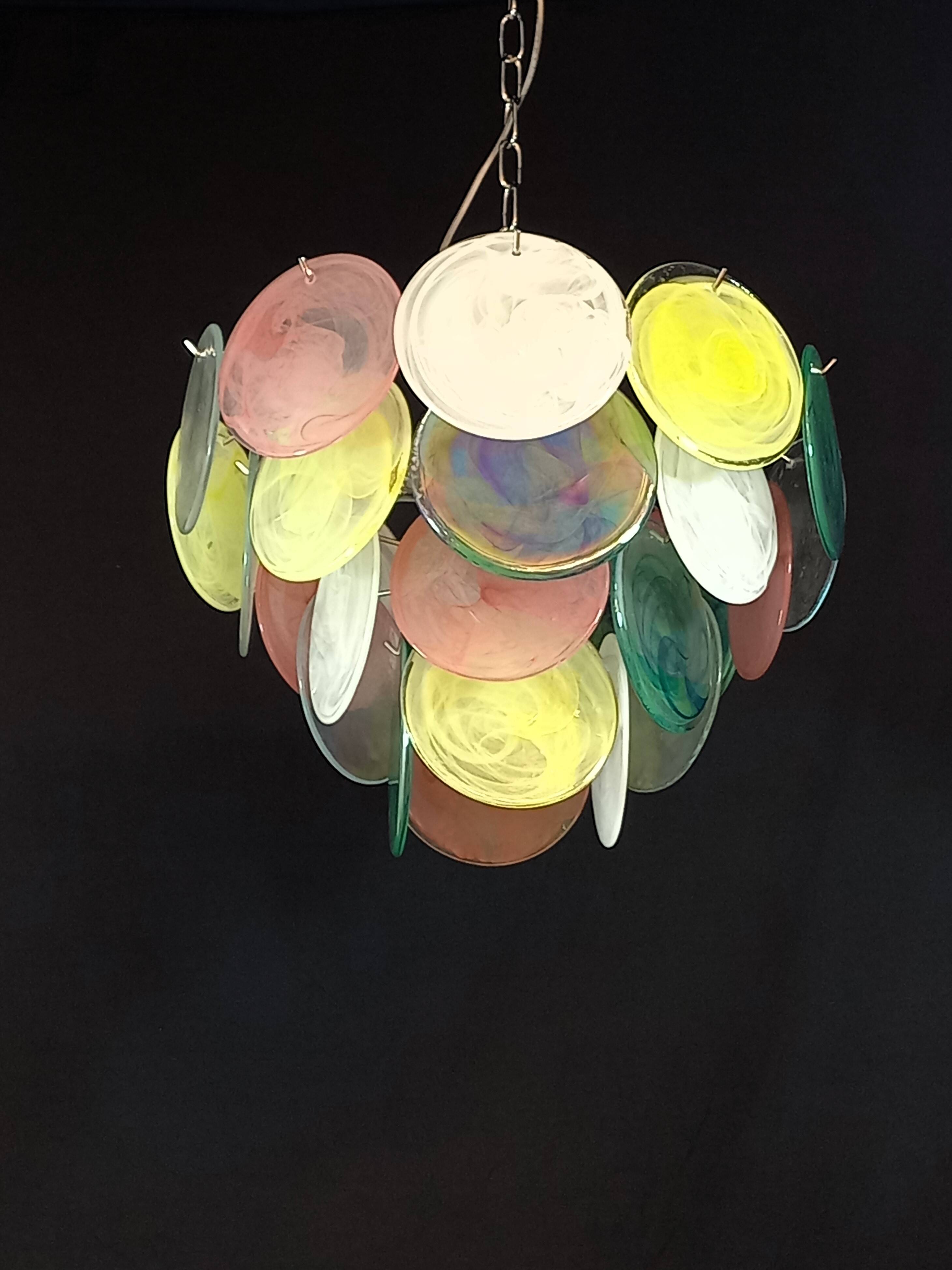 Handcrafted chandelier with Murano glass discs.