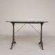 Bistro table with a marble top on a cast iron frame, 1930s.