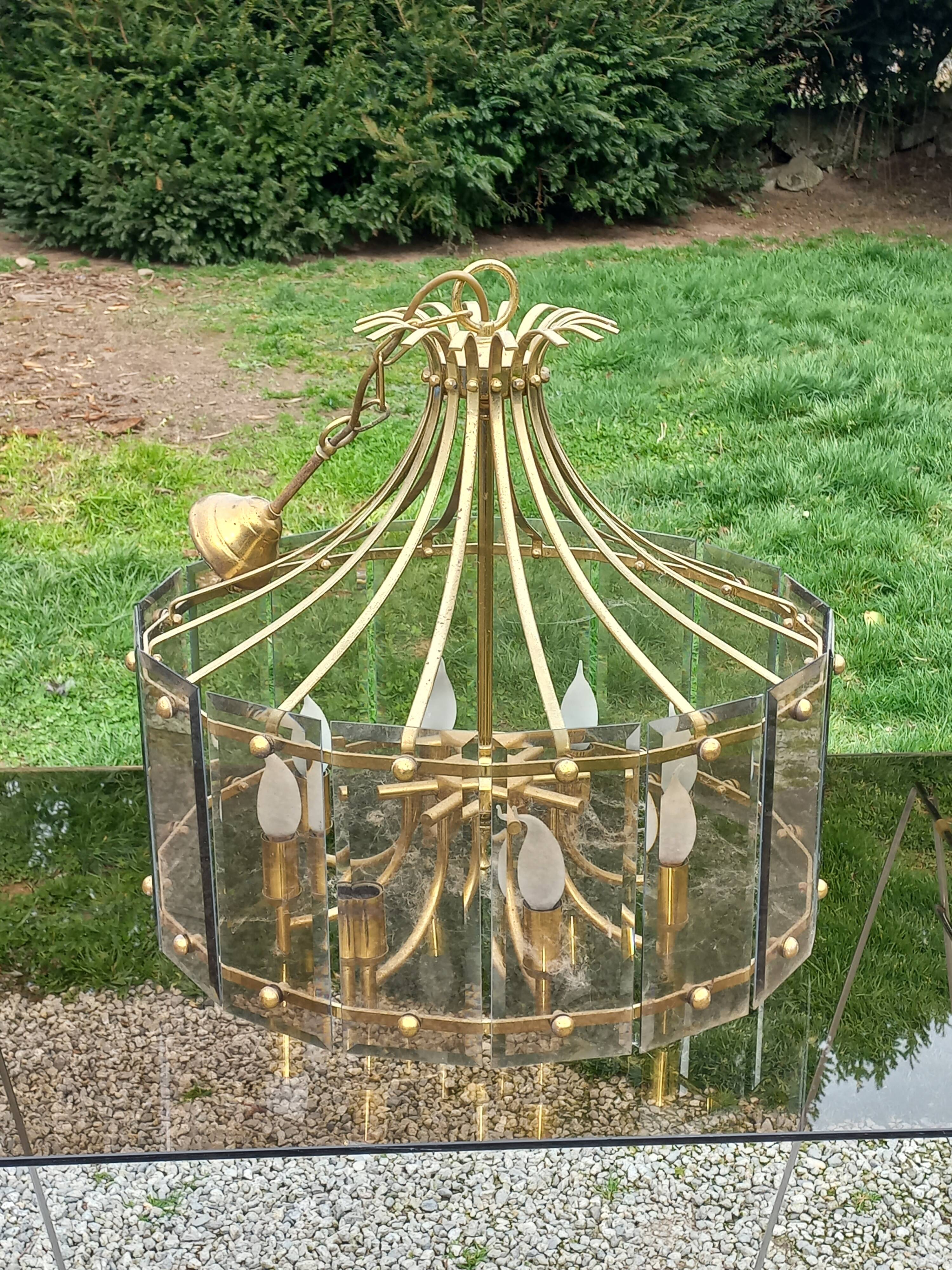 70s designer chandelier with smoked glass plates and gold metal frame