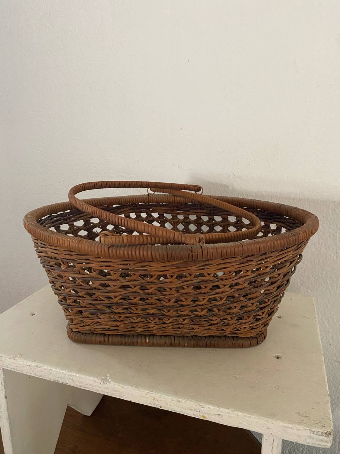 Vintage wicker and cane basket in bohemian style