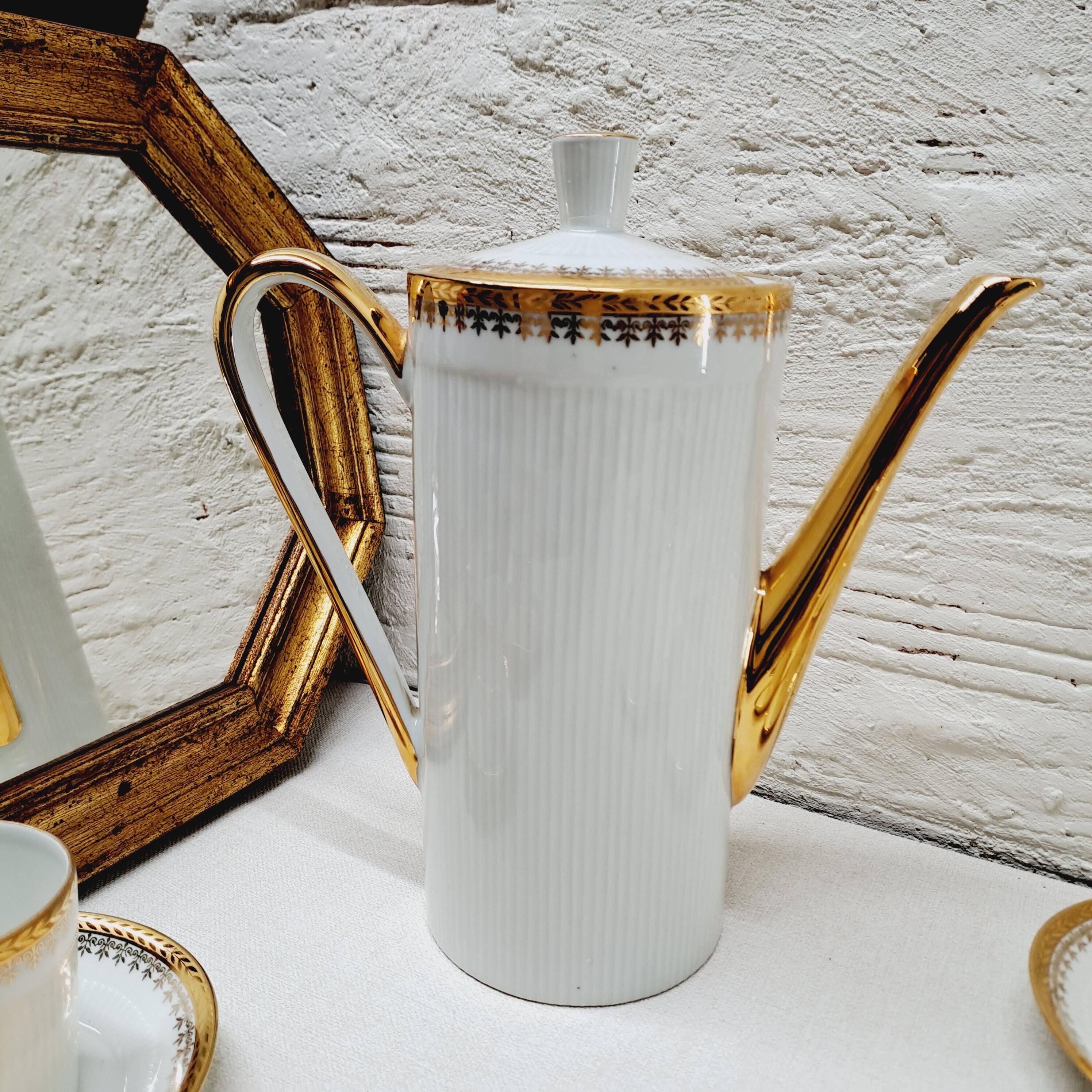 White and gold porcelain coffee maker and cups