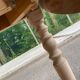 Round dining table with extendable leaves, Louis Philippe style, stripped in raw oak.
