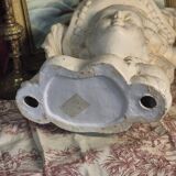 Bust of a woman with a hat