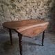 Antique drop-leaf dining table in walnut, France, circa 1900.