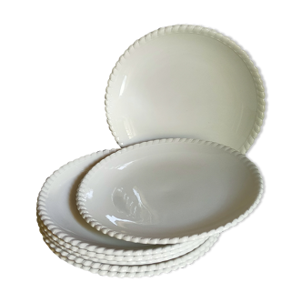 Seven old white barbotine earthenware dessert plates