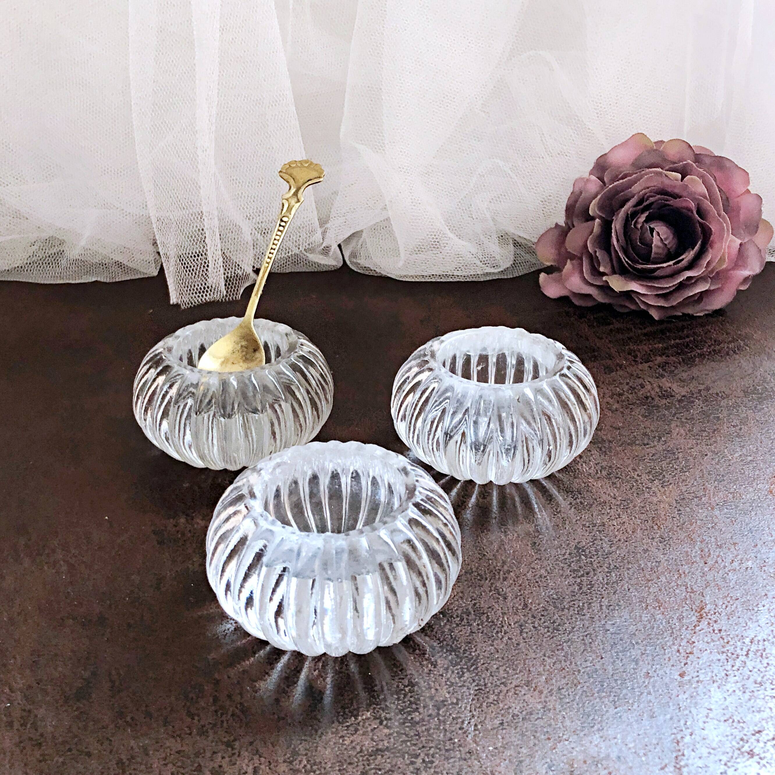 Trio of salt shakers, pepper shakers, molded glass salt shakers