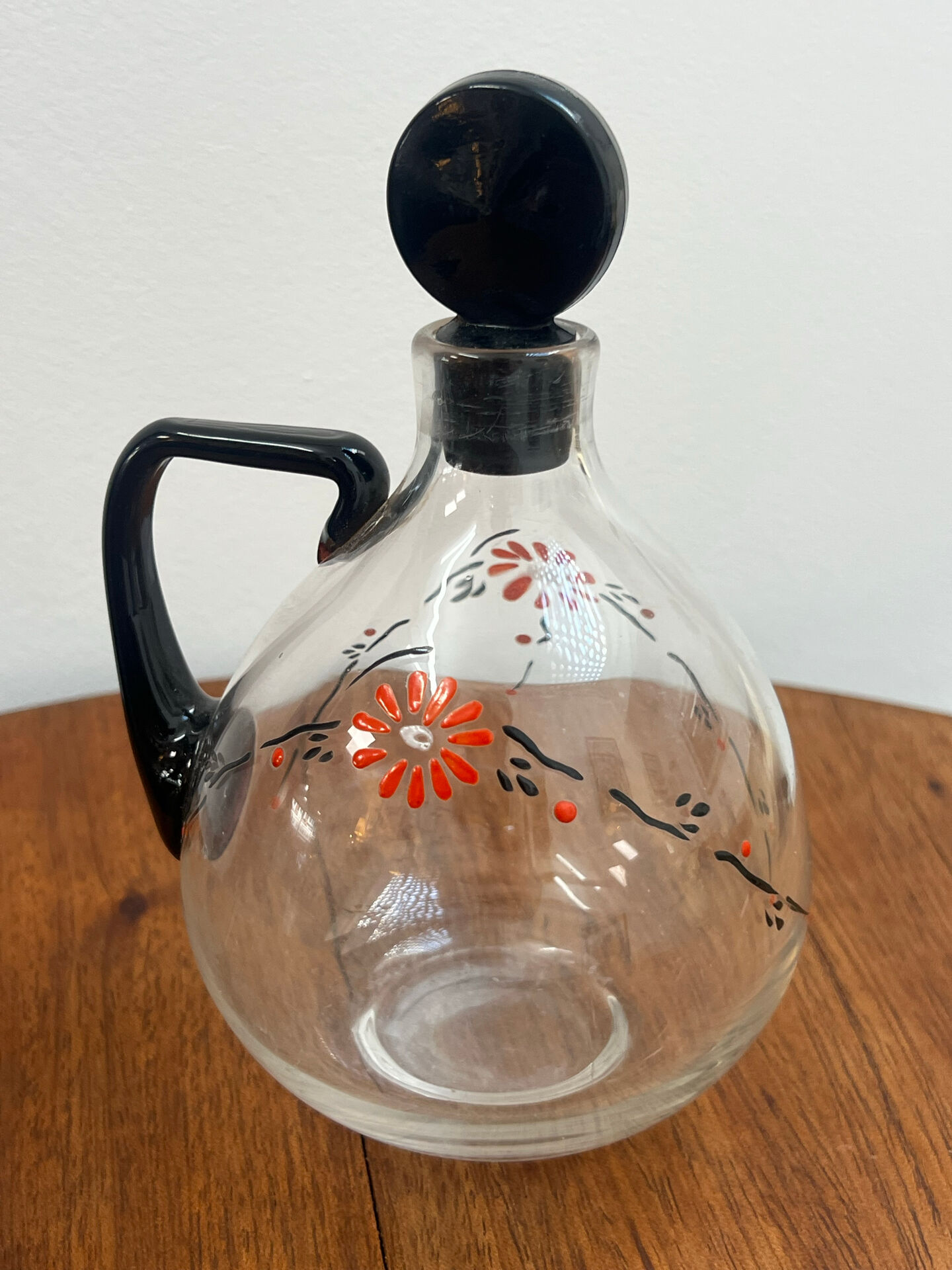 Enamelled glass carafe 1920