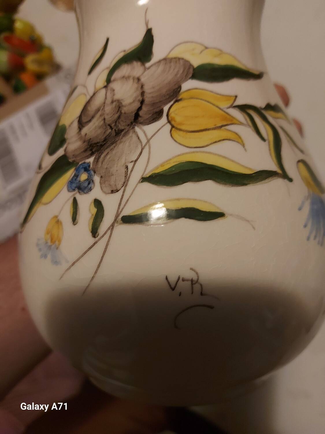 Earthenware pitcher with floral motifs in the Moustiers style, signed.