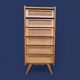 Vintage rattan chest of drawers with splayed legs from the 1950s.
