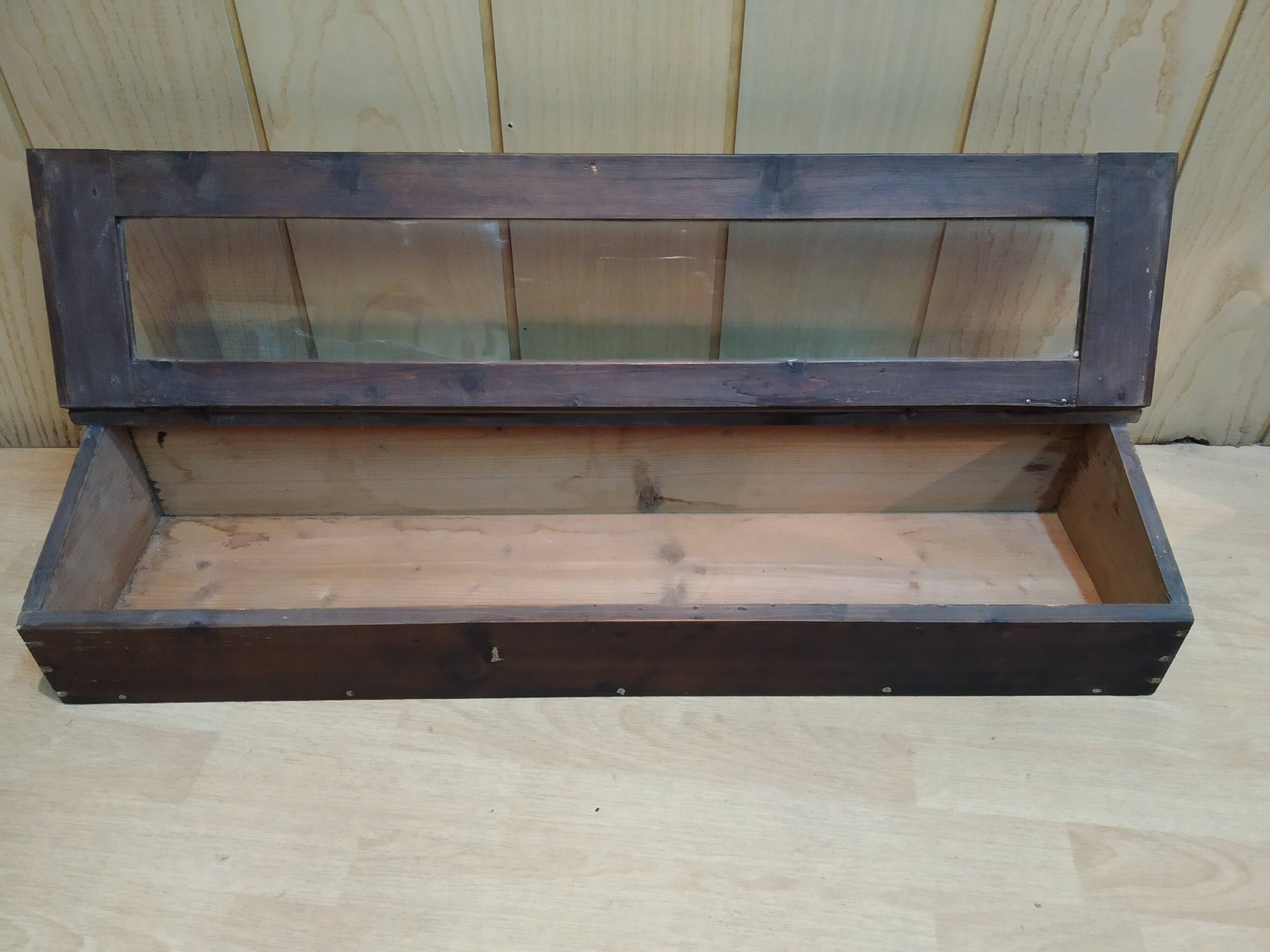 Former wooden display case