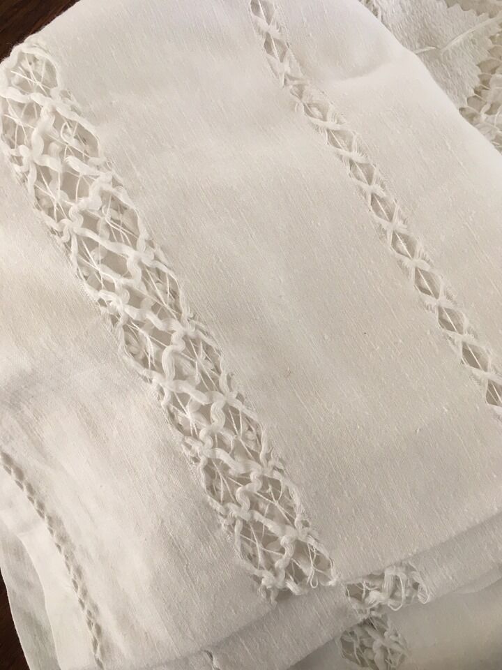 Net-style embroidered cotton tablecloth.