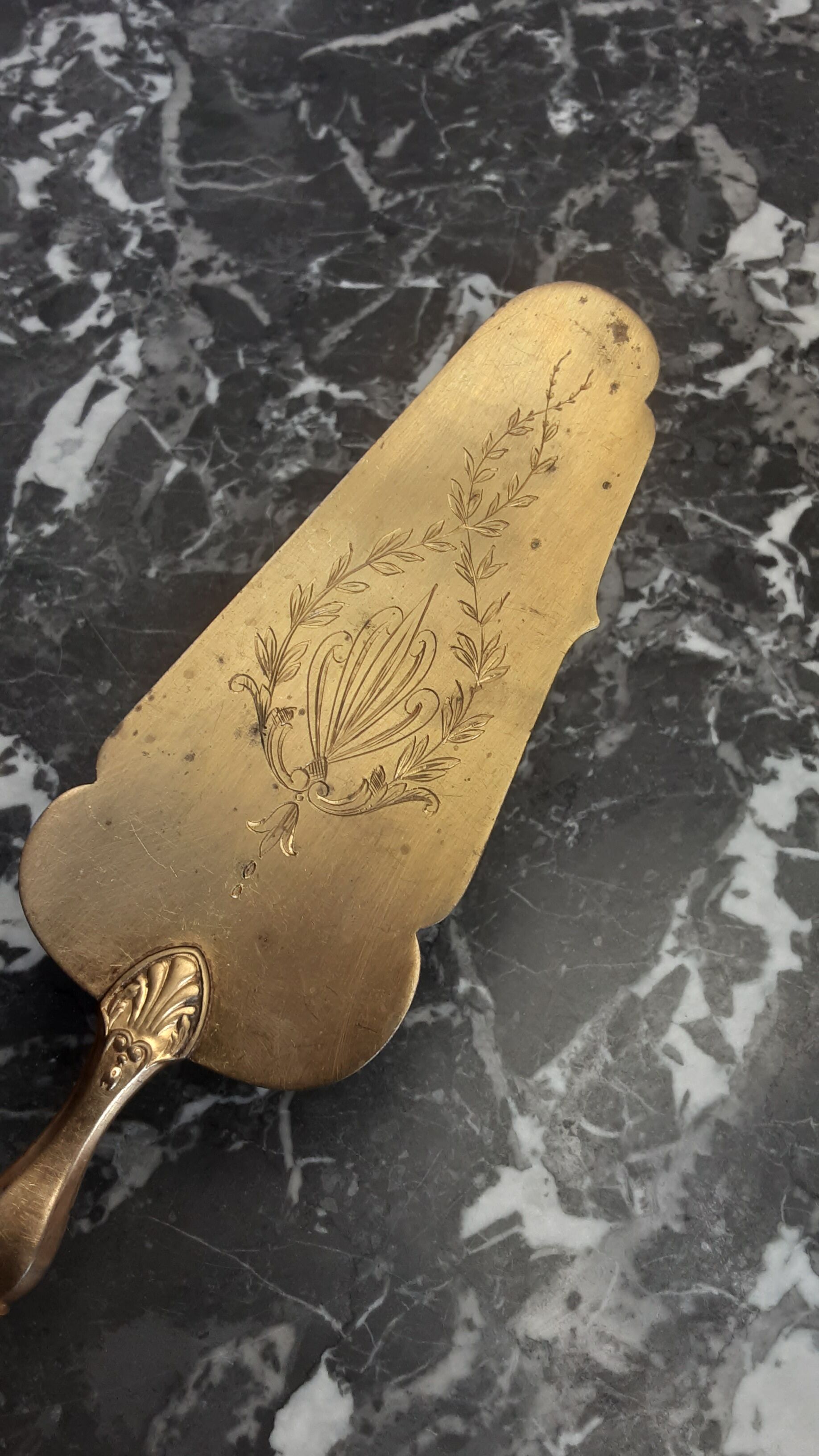 Old brass and silver pie shovel