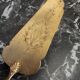 Old brass and silver pie shovel
