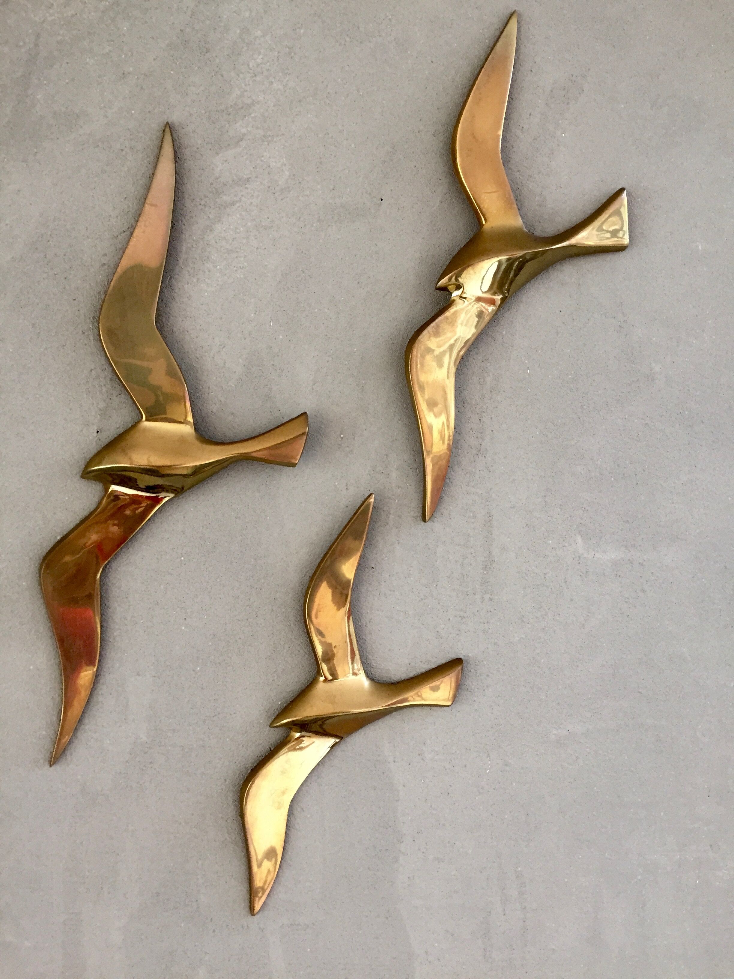 Trio of brass birds
