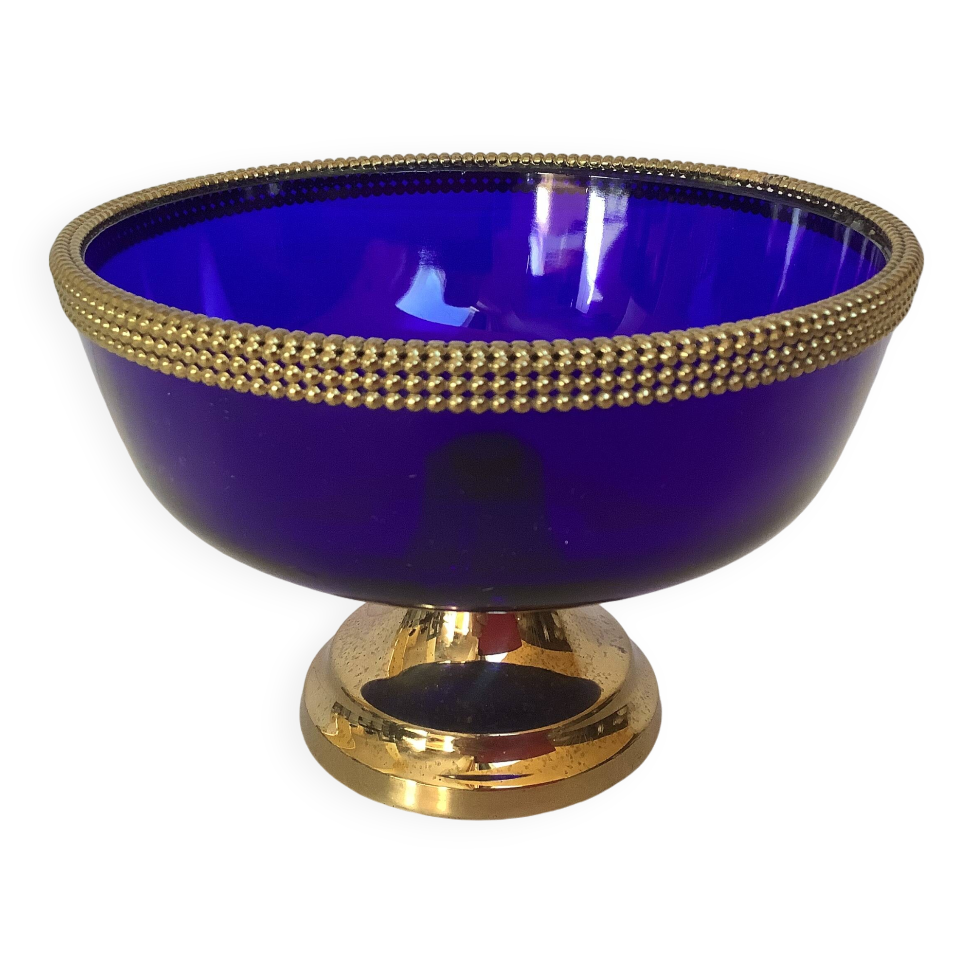 Cobalt blue trinket dish with a beaded pattern.