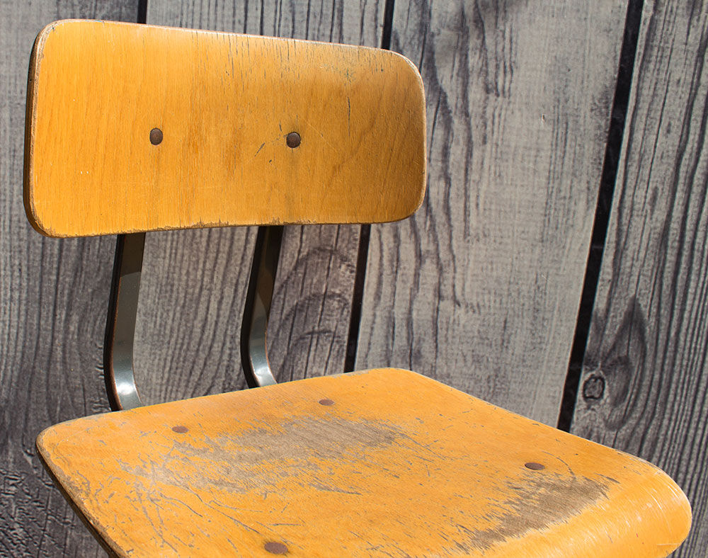 Old metal and wood school chair