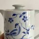 Porcelain teapot with hand-painted bird decoration
