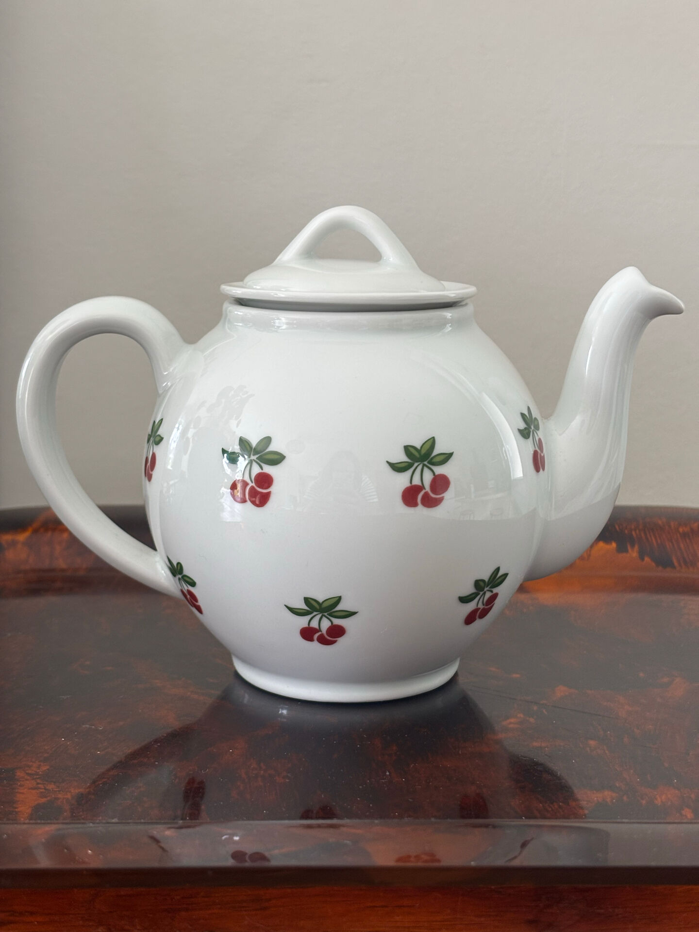 Magnificent teapot and fine porcelain cup set by Pillivuyt with cherries.