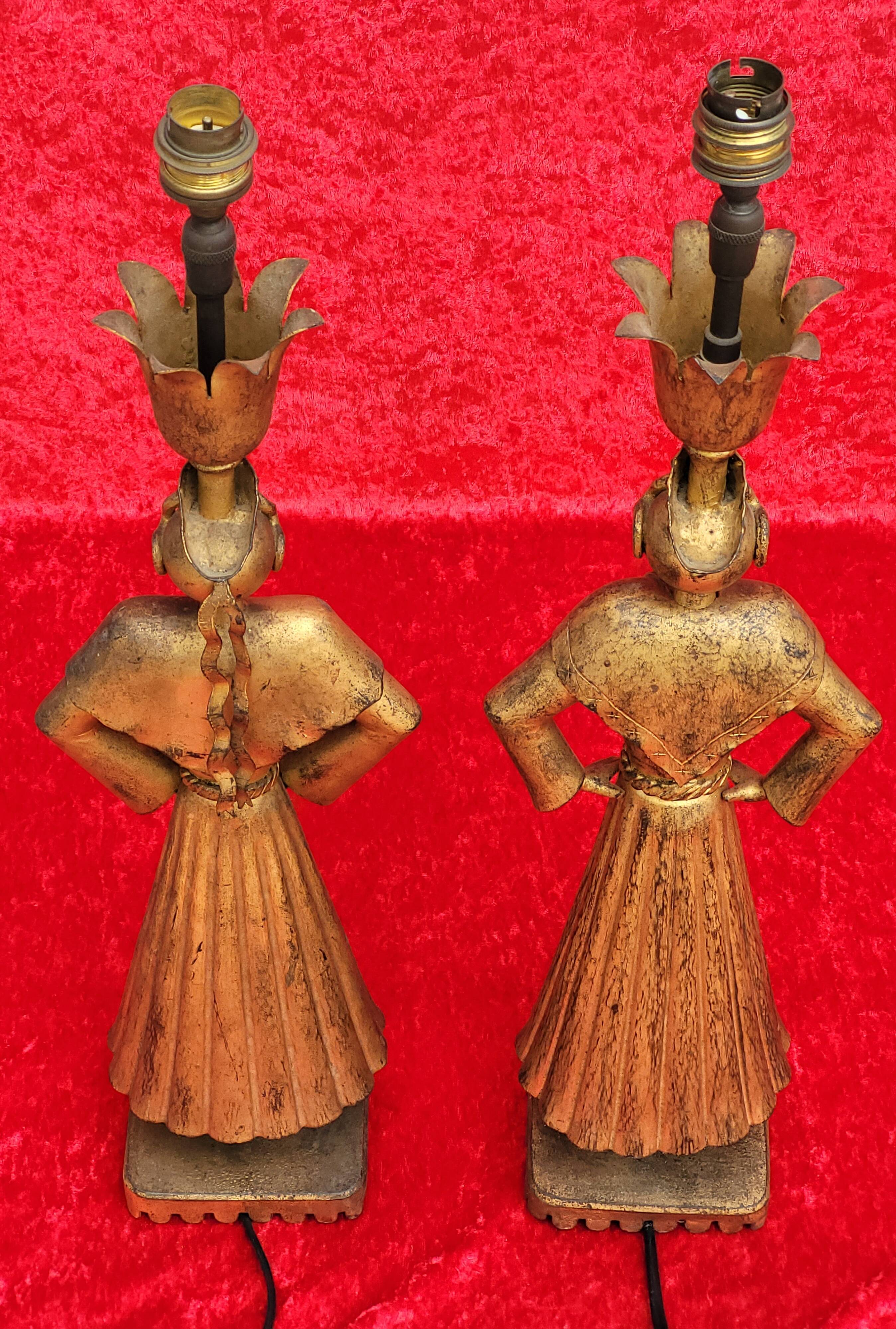 Pair of gilded beaten iron sculpture lamps attributed to Gilbert Poillerat