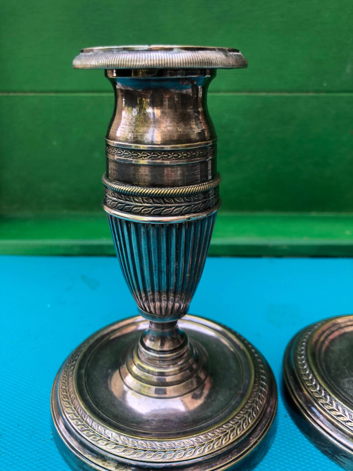 Pair of Louis XVI style candlesticks in silvered bronze