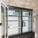 Display cabinet in patinated wood