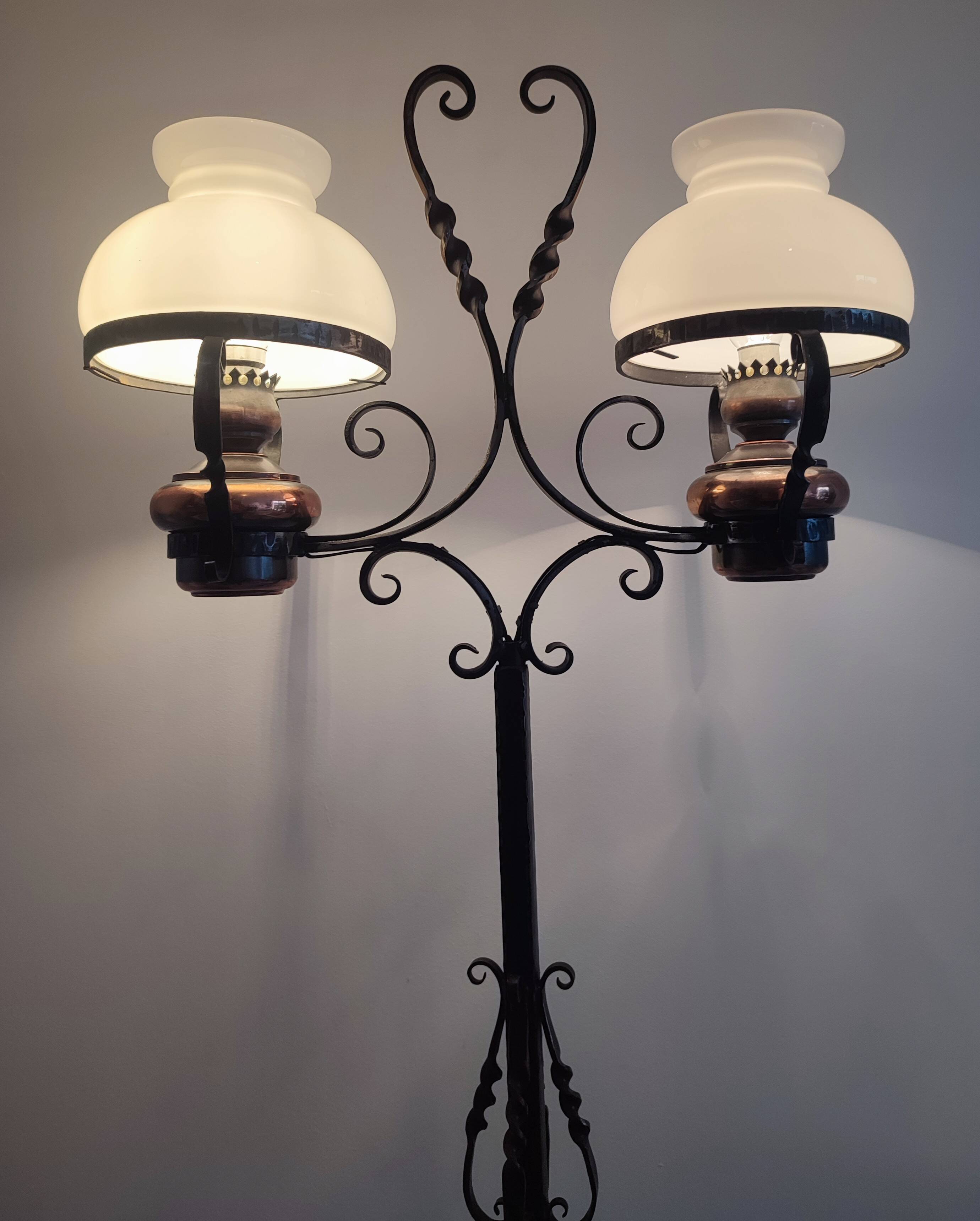 Antique double globe opaline floor lamp, wrought iron, rustic vintage style.