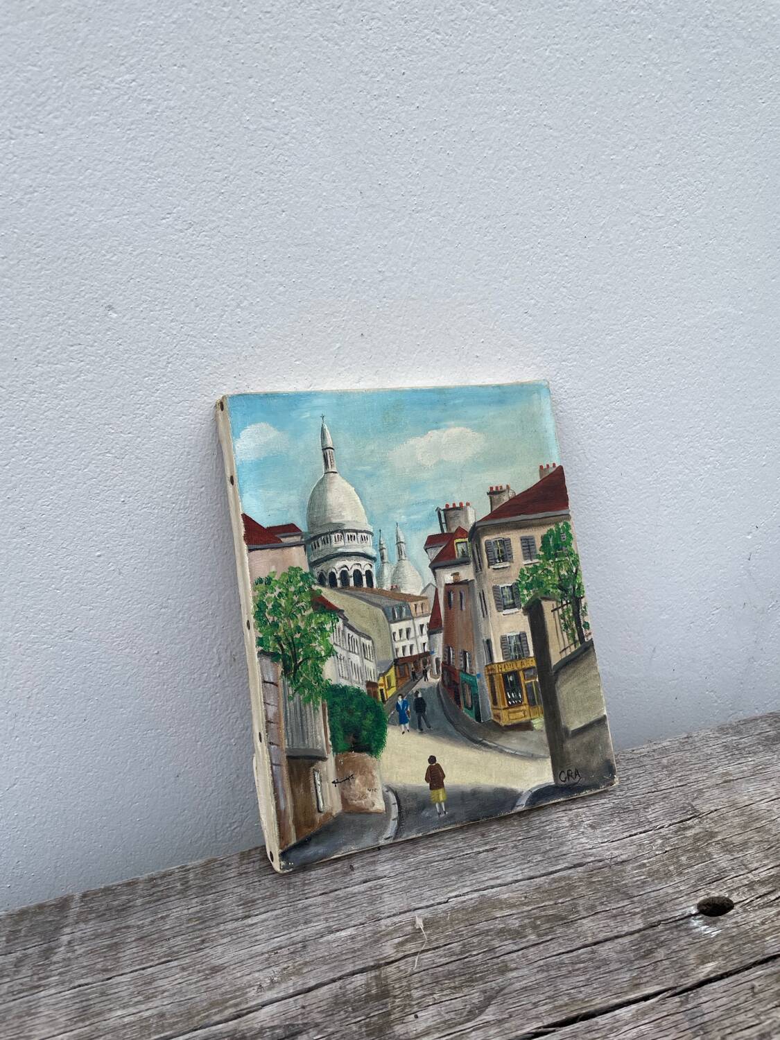 Old oil painting depicting a street in Montmartre