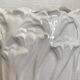 Old white art nouveau vase with flowers and dragonflies
