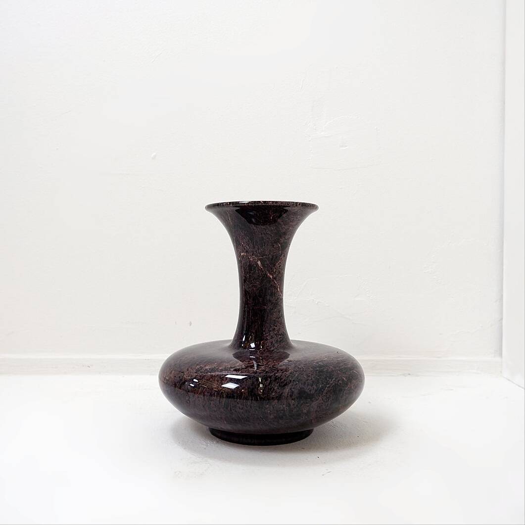 Polished granite vase