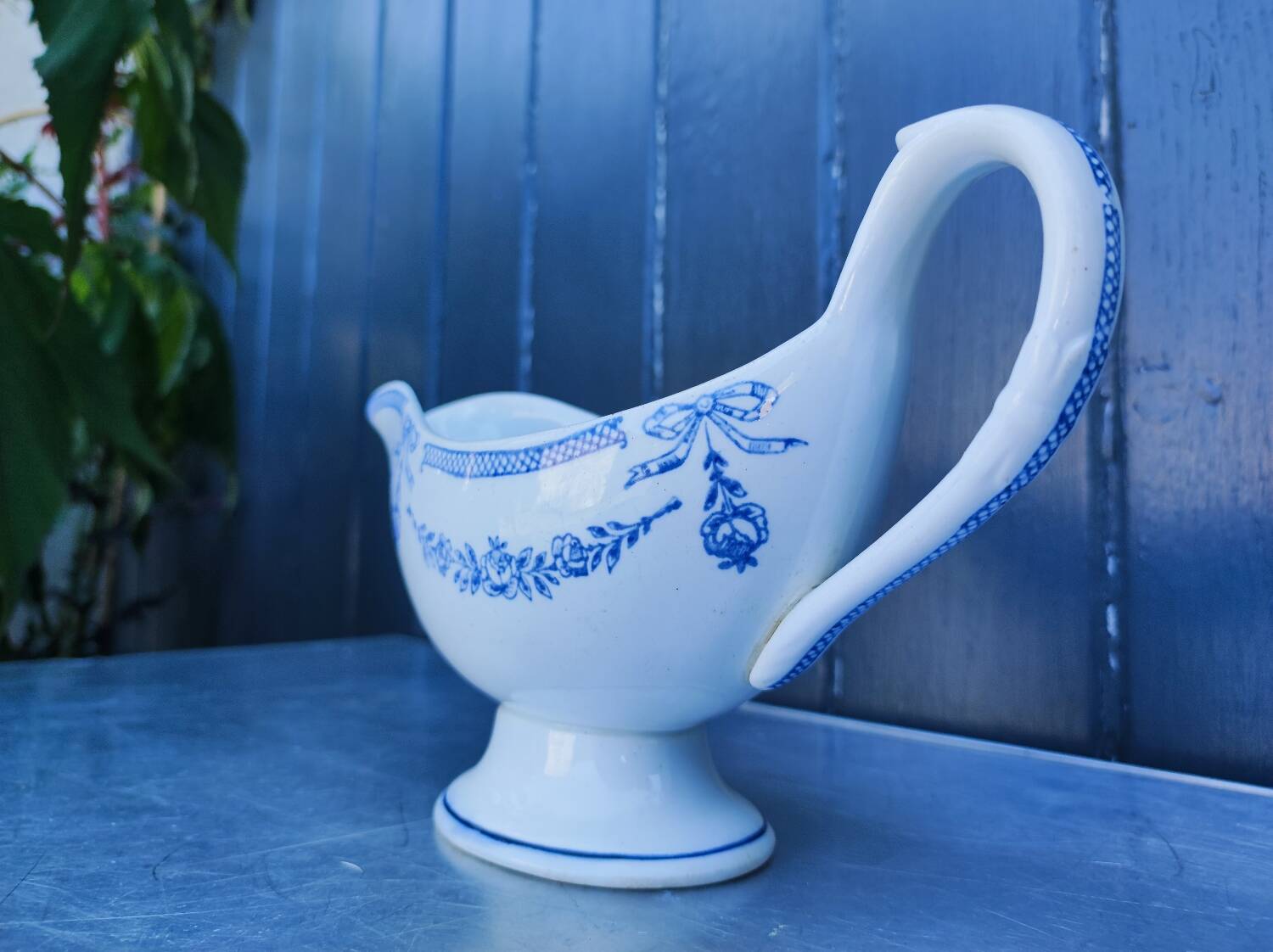 Old earthenware sauce boat