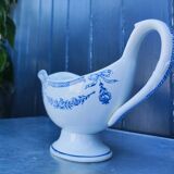 Old earthenware sauce boat