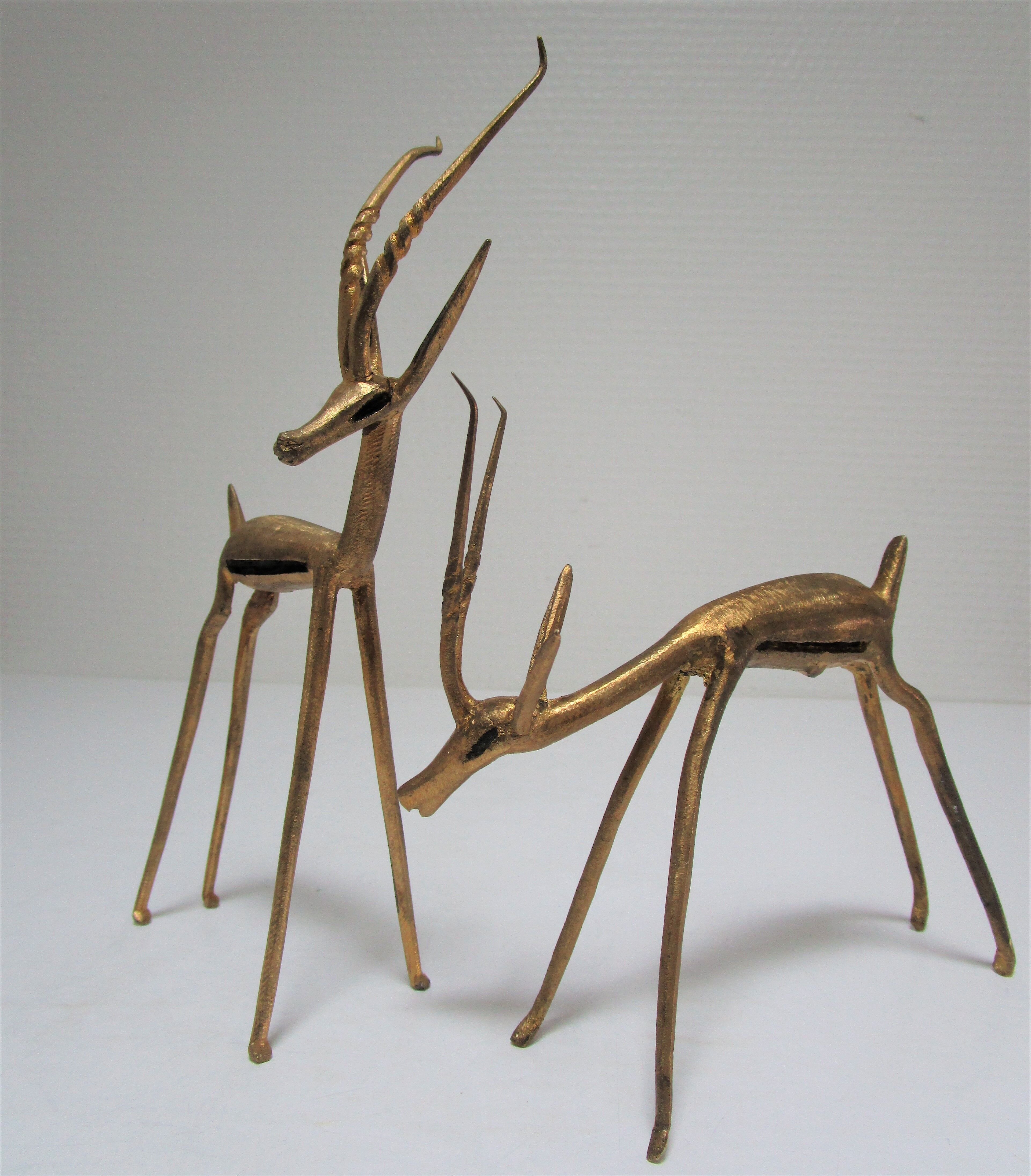 Four vintage brass antelope gazelles